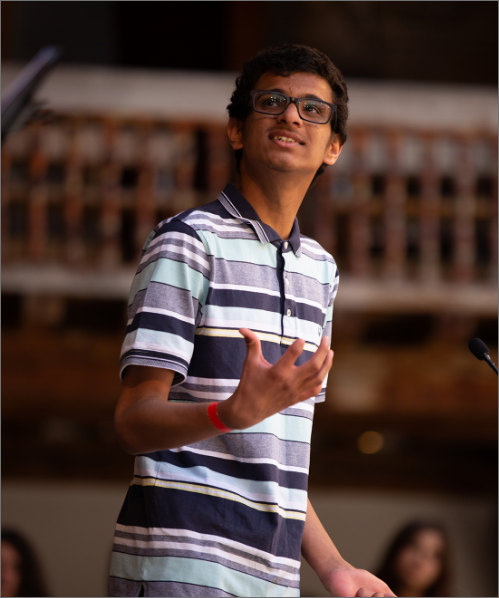 A boy reciting poetry